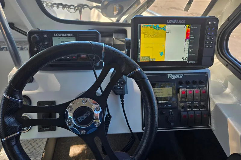 Slide: The Image of Steering console of 2021 Raider 210.Explorer with Lowrance navigation system. - 9