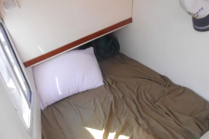 Slide: The Image of 2008 Four Winns H Series H310 boat bathroom with toilet, countertop, and decorative mirror. - 11