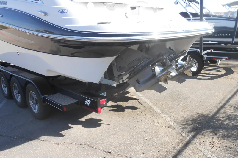 Slide: The Image of 2008 Four Winns H Series H310 boat emblem on white surface. - 3