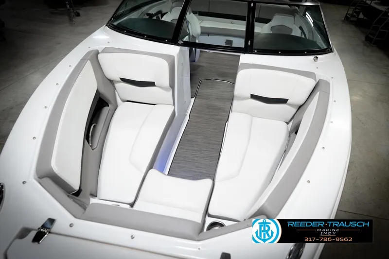 Slide: The Image of 2020 Four Winns H210 boat interior with white seating and sleek design. - 11