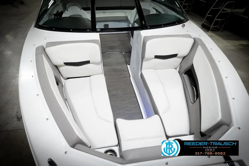 Slide: The Image of 2020 Four Winns H210 boat interior with white seating and modern design. - 12