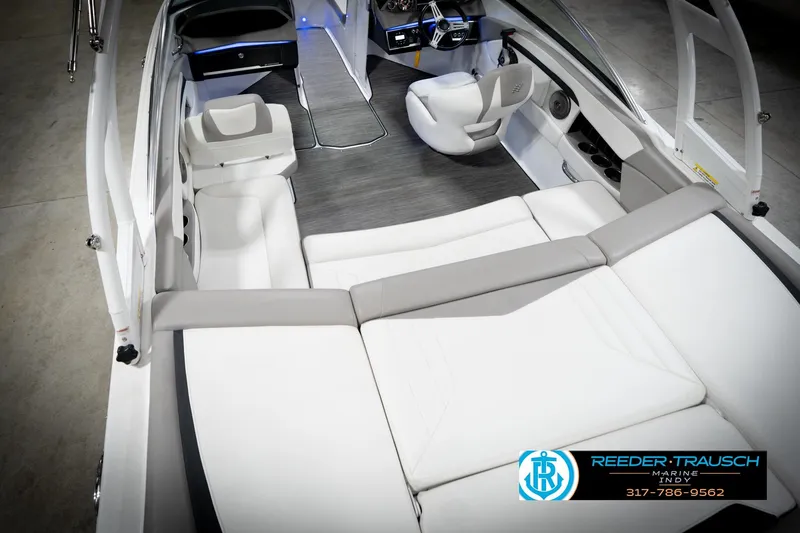 Slide: The Image of 2020 Four Winns H210 boat interior with white seating and modern dashboard. - 14
