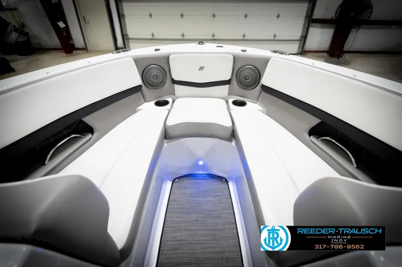 Slide: The Image of Interior of 2020 Four Winns H210 boat with seating and cup holders. - 17