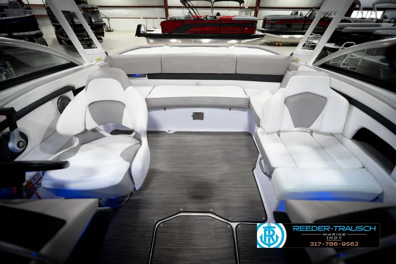 Slide: The Image of Interior of 2020 Four Winns H210 boat with white and gray seating. - 19