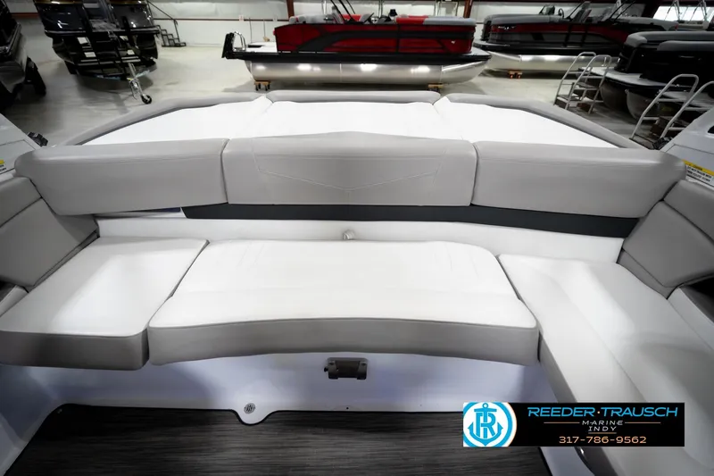 Slide: The Image of 2020 Four Winns H210 boat interior with gray seating in showroom. - 20