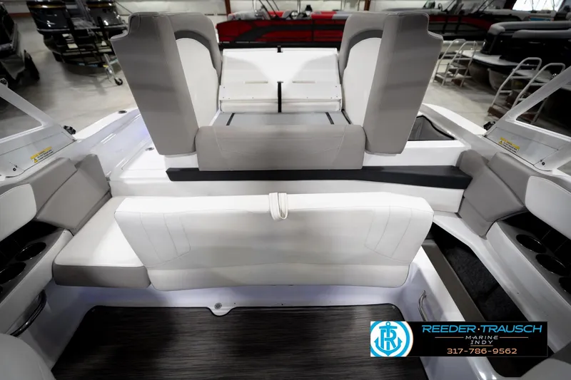 Slide: The Image of 2020 Four Winns H210 boat interior with white seating and modern design. - 21