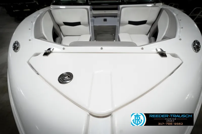 Slide: The Image of 2020 Four Winns H210 boat interior with white seating and sleek design. - 29