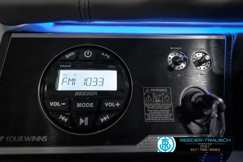 Slide: The Image of 2020 Four Winns H210 boat dashboard with Kicker audio system and controls. - 34