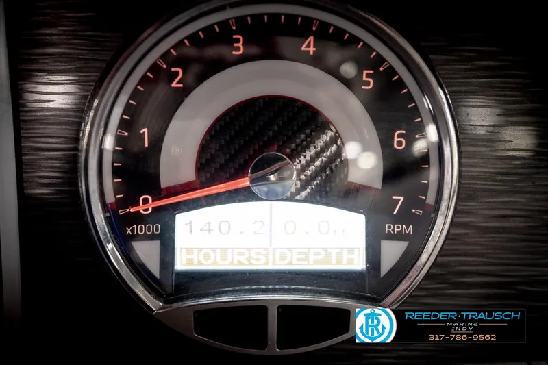Slide: The Image of Tachometer of 2020 Four Winns H210 boat displaying RPM and hours. - 36