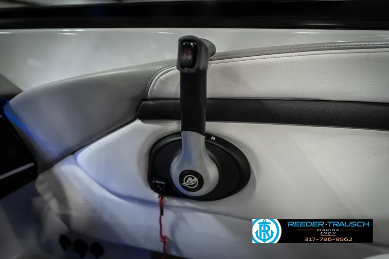 Slide: The Image of 2020 Four Winns H210 boat throttle control, featuring sleek design and ergonomic handle. - 39