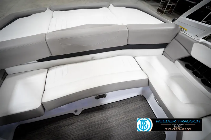 Slide: The Image of 2020 Four Winns H210 boat interior with white and gray seating. - 41