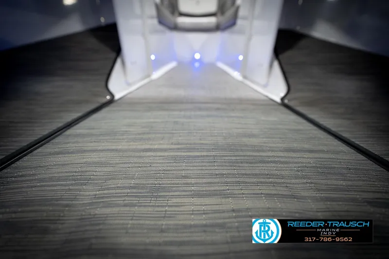 Slide: The Image of 2020 Four Winns H210 boat interior with sleek flooring and ambient lighting. - 46