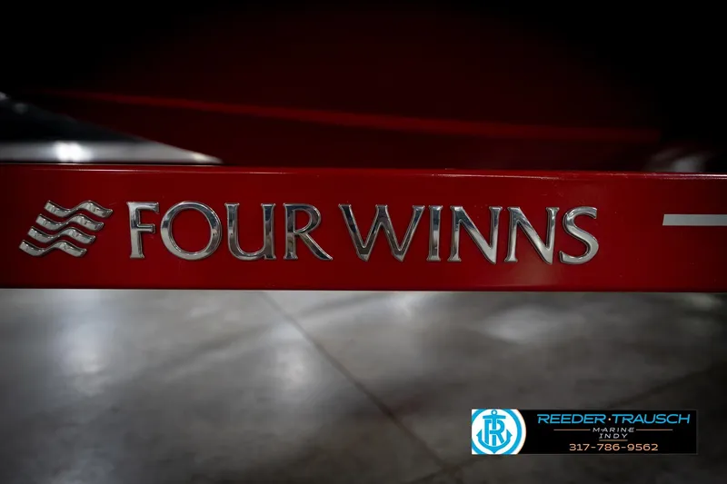 Slide: The Image of Red Four Winns H210 boat trailer with logo, 2020 model. - 52