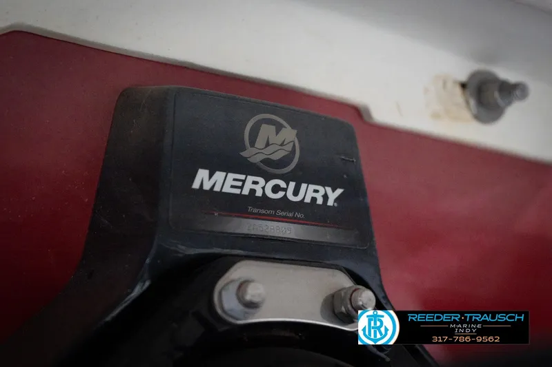 Slide: The Image of Mercury engine component on a 2020 Four Winns H210 boat, Reeder-Trausch Marine branding visible. - 56