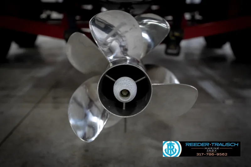 Slide: The Image of Close-up of a 2020 Four Winns H210 boat propeller in a garage setting. - 58