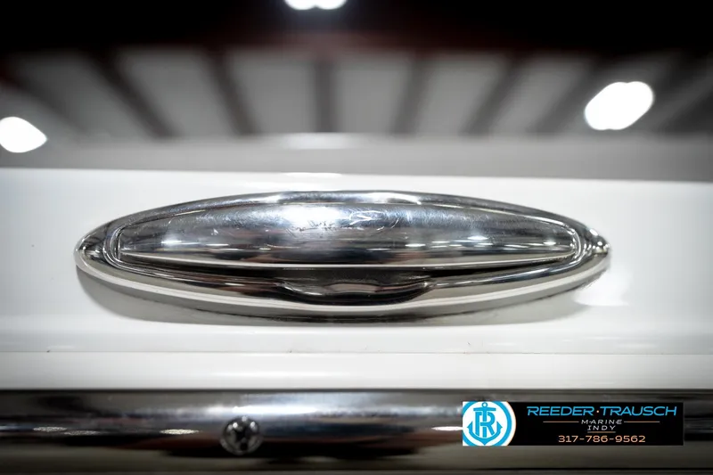Slide: The Image of Close-up of a 2020 Four Winns H210 boat detail with chrome finish. - 59