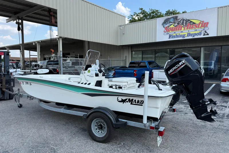 Slide: The Image of 2022 Mako Pro Skiff 15 CC boat on trailer at South Austin Marine. - 2