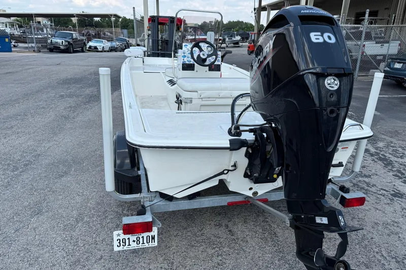 Slide: The Image of 2022 Mako Pro Skiff 15 CC with Mercury 60 engine on trailer. - 3