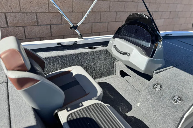 Slide: The Image of 2023 G3 SPORTSMAN 170 boat interior with seating and console details. - 16