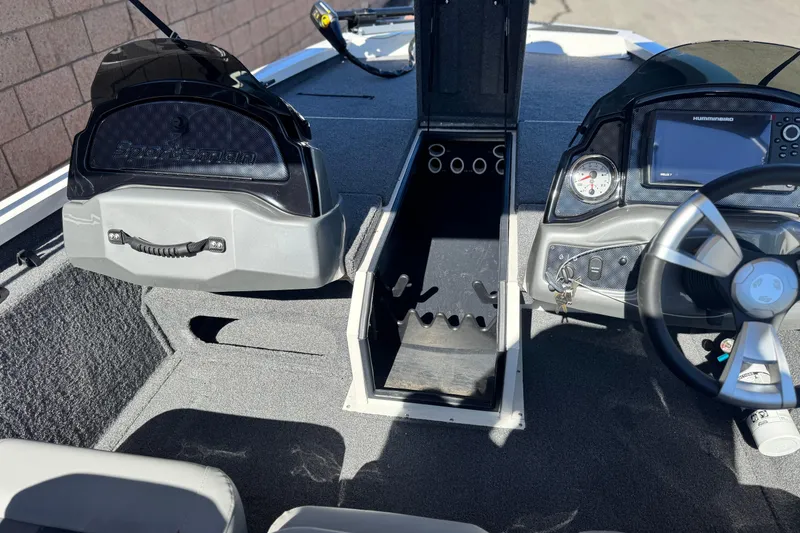 Slide: The Image of 2023 G3 SPORTSMAN 170 boat interior with steering wheel, dashboard, and storage compartments. - 17