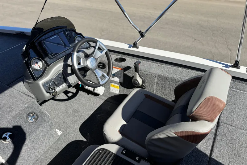 Slide: The Image of 2023 G3 SPORTSMAN 170 boat interior with steering wheel and seat. - 18