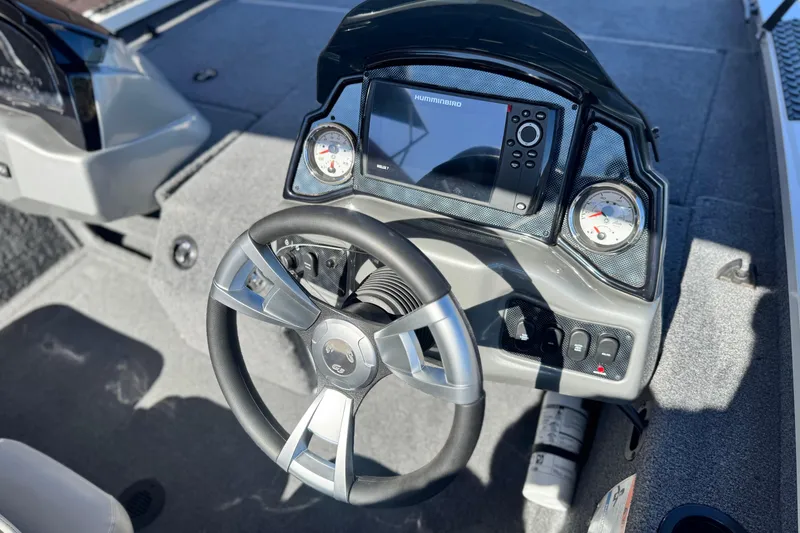 Slide: The Image of 2023 G3 SPORTSMAN 170 boat dashboard with steering wheel and electronic display. - 20