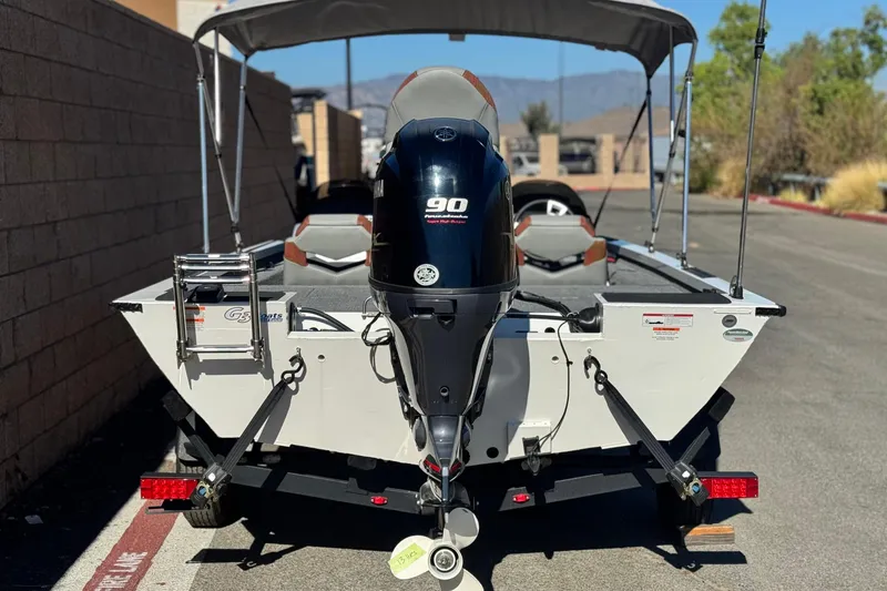 Slide: The Image of 2023 G3 SPORTSMAN 170 boat with Yamaha 90 engine, parked outdoors. - 4