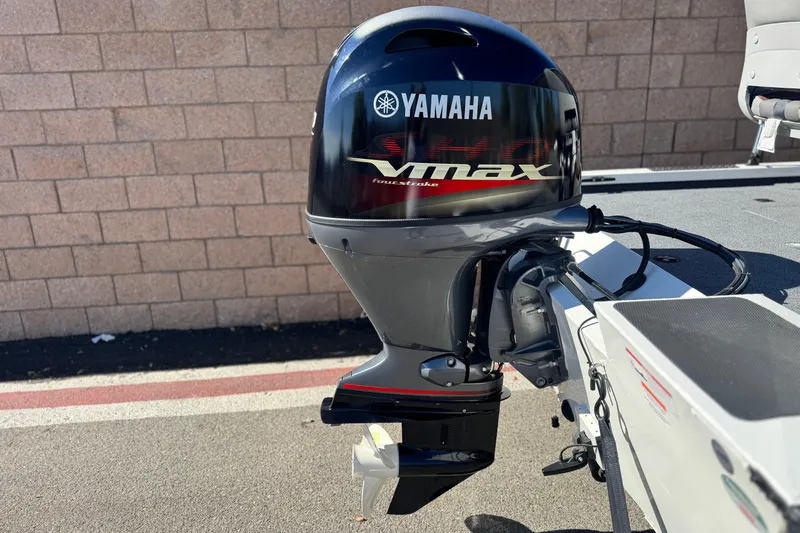 Slide: The Image of 2023 G3 SPORTSMAN 170 with Yamaha Vmax outboard motor, parked on pavement. - 6