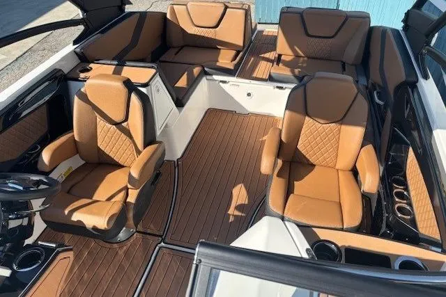 Slide: The Image of 2026 Yamaha Boats 252SD interior with luxurious tan seating and sleek design. - 12
