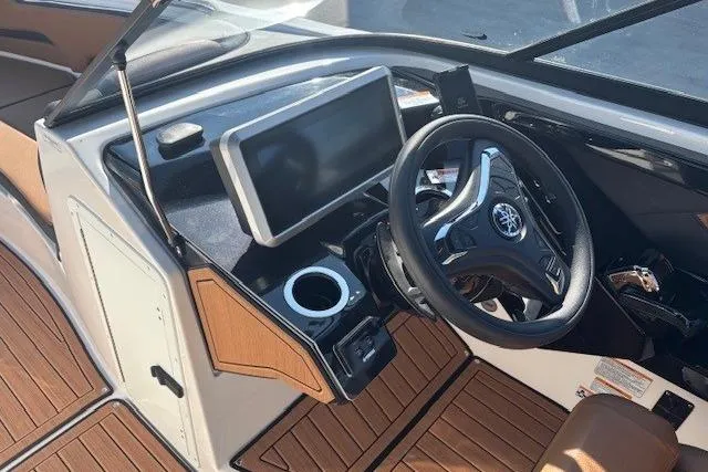 Slide: The Image of 2026 Yamaha Boats 252SD dashboard with steering wheel and touchscreen display. - 16