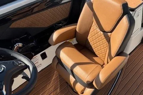 Slide: The Image of Luxurious interior of 2026 Yamaha Boats 252SD with tan leather seating. - 20