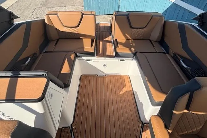 Slide: The Image of 2026 Yamaha Boats 252SD interior with tan seating and wood-style flooring. - 21