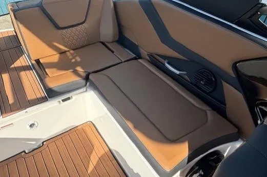 Slide: The Image of 2026 Yamaha Boats 252SD interior with brown seating and modern design. - 25