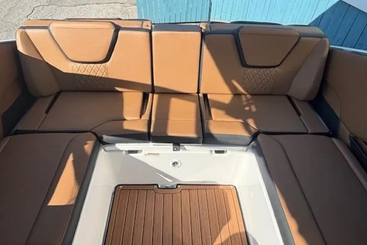 Slide: The Image of 2026 Yamaha Boats 252SD interior with tan seating and wood accents. - 29