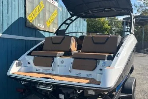 Slide: The Image of 2026 Yamaha Boats 252SD with sleek design and comfortable seating, docked outdoors. - 3