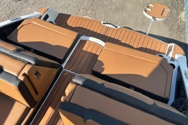Slide: The Image of Luxurious interior of 2026 Yamaha Boats 252SD with tan seating and sleek design. - 31