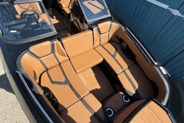 Slide: The Image of 2026 Yamaha Boats 255XD interior with tan leather seating and modern design. - 10