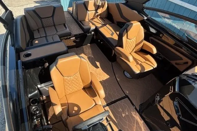 Slide: The Image of Luxurious interior of 2026 Yamaha Boats 255XD with tan leather seating and modern design. - 11