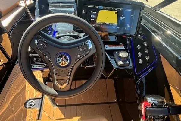 Slide: The Image of 2026 Yamaha Boats 255XD dashboard with steering wheel and digital display. - 13