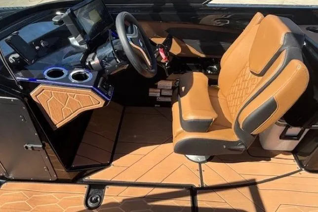 Slide: The Image of 2026 Yamaha Boats 255XD cockpit with tan seating and modern dashboard. - 15