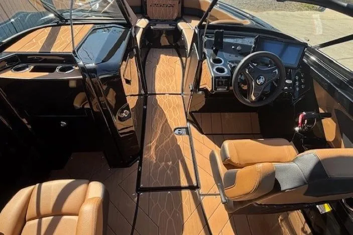 Slide: The Image of 2026 Yamaha Boats 255XD interior with sleek design, modern dashboard, and comfortable seating. - 19