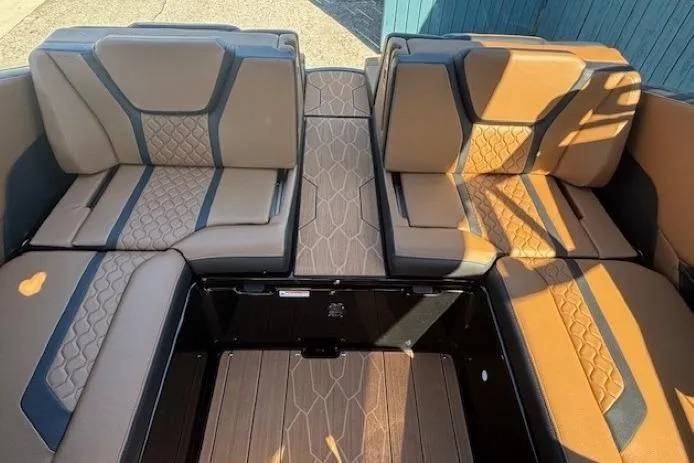 Slide: The Image of 2026 Yamaha Boats 255XD interior with luxurious tan and black seating, showcasing modern design. - 26