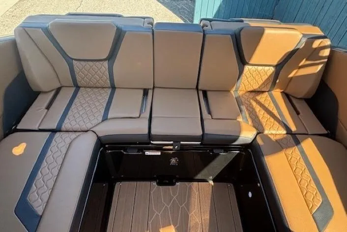 Slide: The Image of 2026 Yamaha Boats 255XD interior seating with brown and black upholstery. - 27