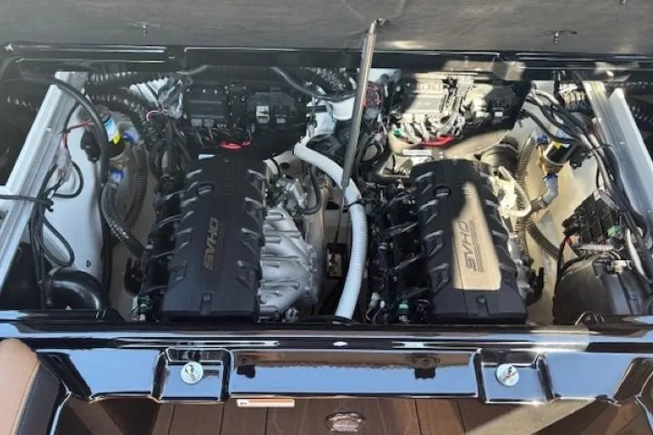 Slide: The Image of 2026 Yamaha Boats 255XD engine compartment with dual engines and advanced wiring. - 28