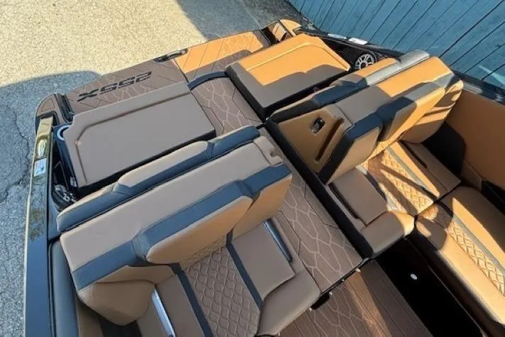 Slide: The Image of 2026 Yamaha Boats 255XD interior with luxurious brown seating and modern design. - 29