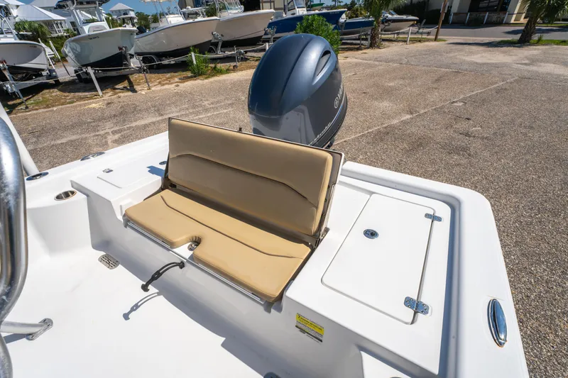 Slide: The Image of 2016 Sportsman Masters 207 Bay Boat with tan seating and Yamaha outboard motor. - 12