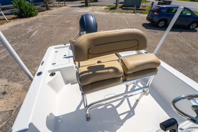 Slide: The Image of 2016 Sportsman Masters 207 Bay Boat with tan seating and steering console. - 14