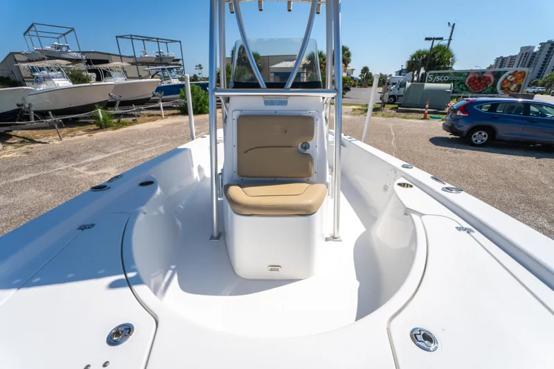 Slide: The Image of 2016 Sportsman Masters 207 Bay Boat with center console and seating, parked outdoors. - 20