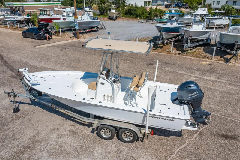 Slide: The Image of 2016 Sportsman Masters 207 Bay Boat on trailer, parked in a marina lot. - 24