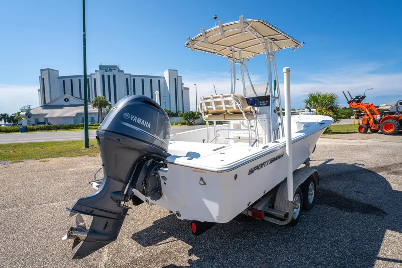 Slide: The Image of 2016 Sportsman Masters 207 Bay Boat with Yamaha engine on trailer, parked outdoors. - 3